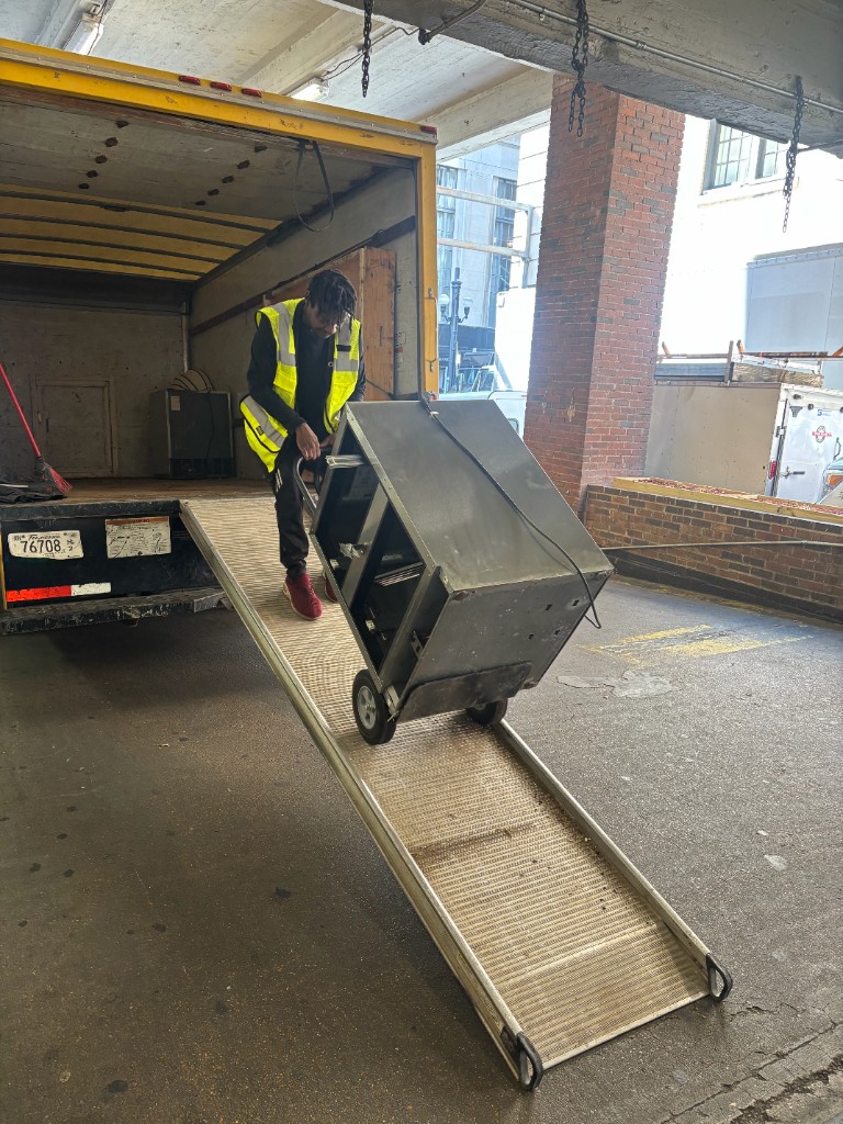 Loading heavy equipment up ramp
